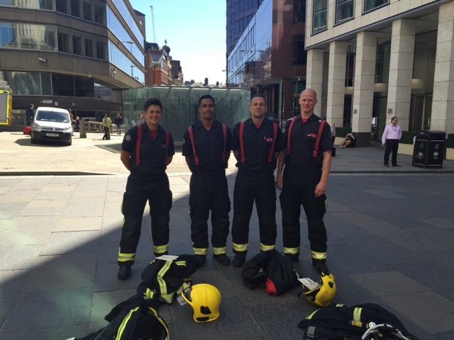 Smiles all round - Firefighters about to climb up The Monument in full uniform... 